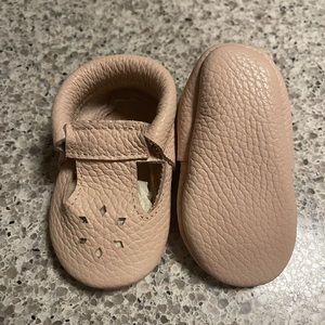 Pale pink baby girl moccasins